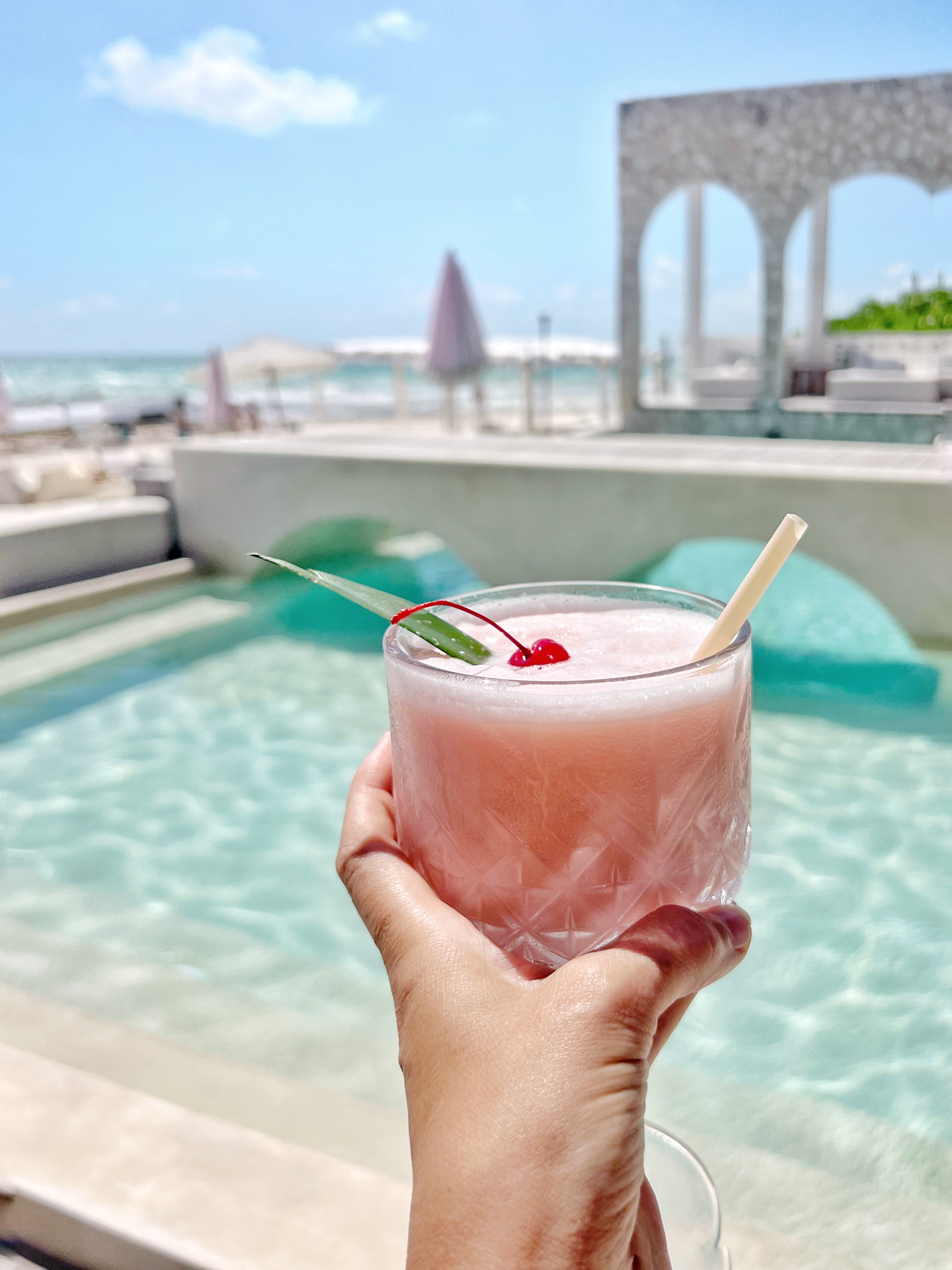 Pink cocktail at Chi Ka Chica pool Tulum