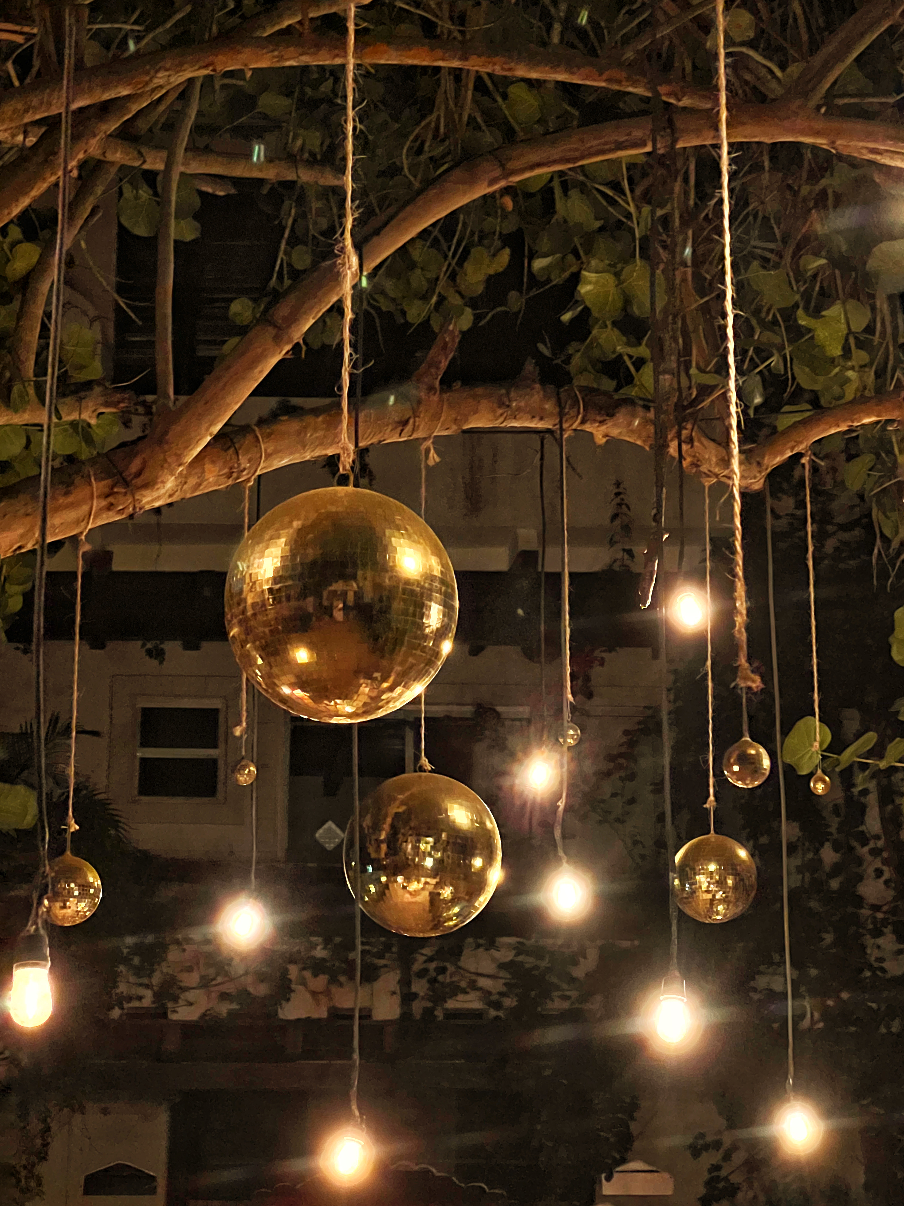 Golden disco balls and string lights at Chi Ka Amansala Tulum